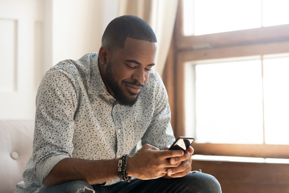 happy man using phone