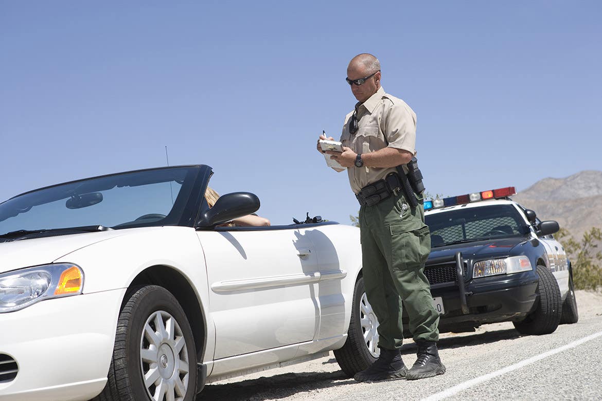 officer writing ticket